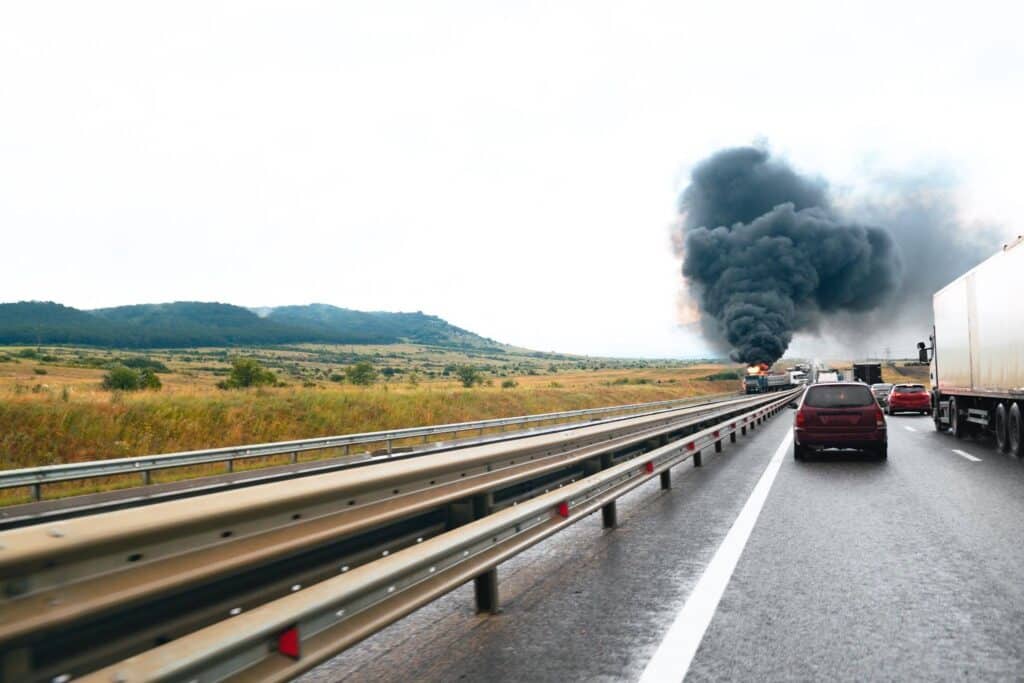 Truck crash on the highway with smoke